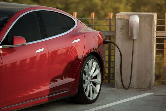 Red Model S charging at a Tesla Destination Charging site