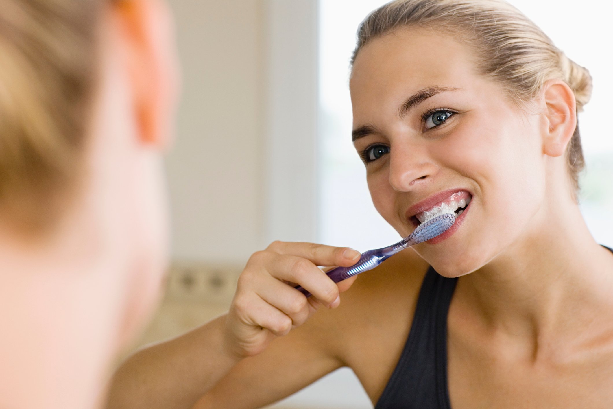 Woman brushing her teeth