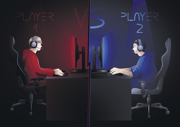 Illustration of two video game players, one on the red team and one on the blue team, playing against each other in desks facing each other. 