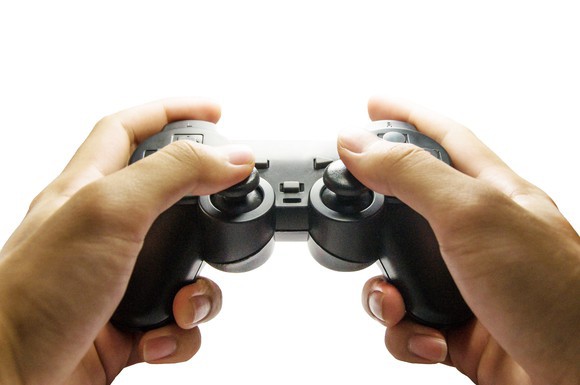 A person using a video game controller. 