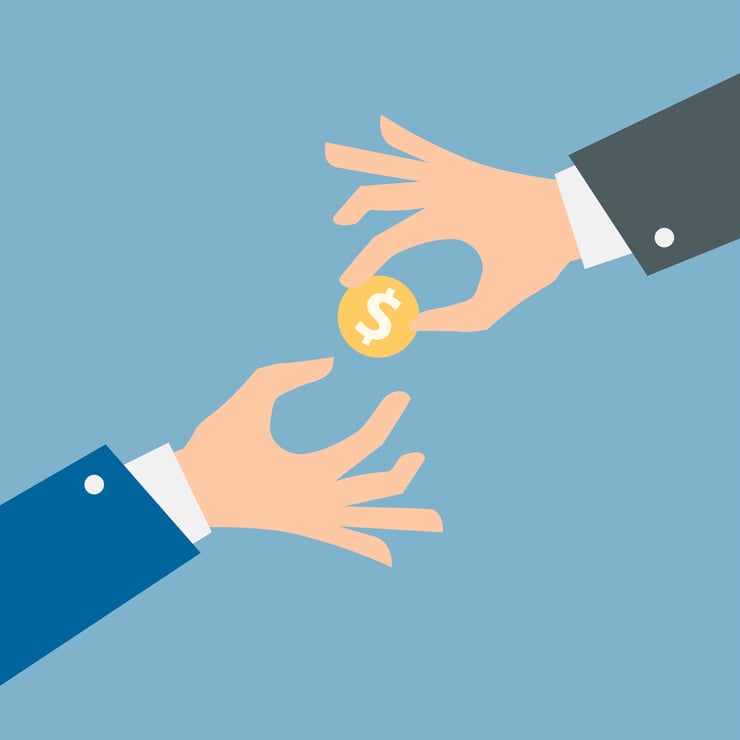 Two businesspeople's hands exchanging a gold coin imprinted with the U.S. dollar symbol