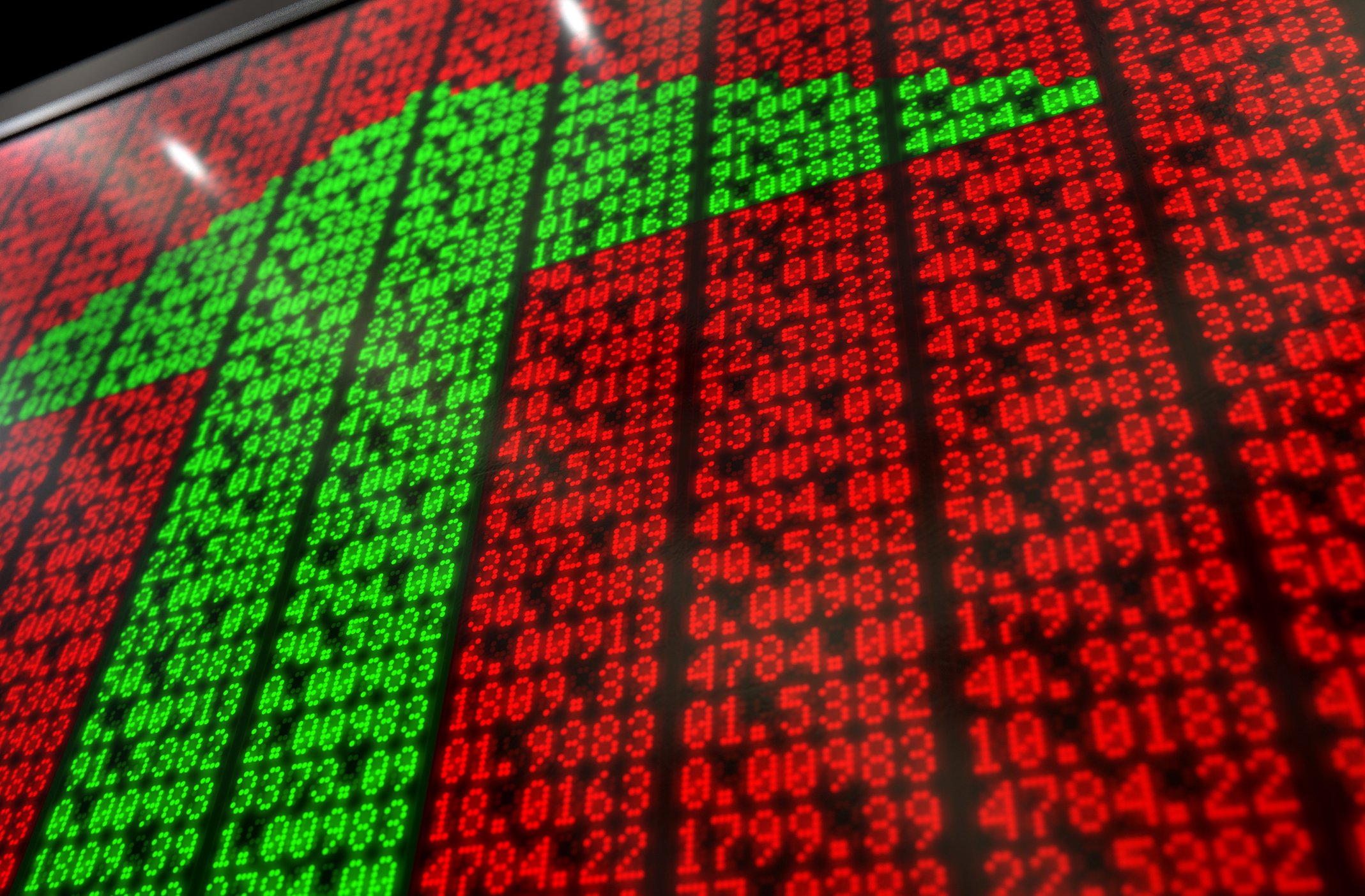 LED display of rows of numbers in red, surrounding numbers in green arranged in shape of an upward pointing arrow.