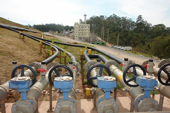 Compressors and pipelines gathering renewable biomethane from a landfill.