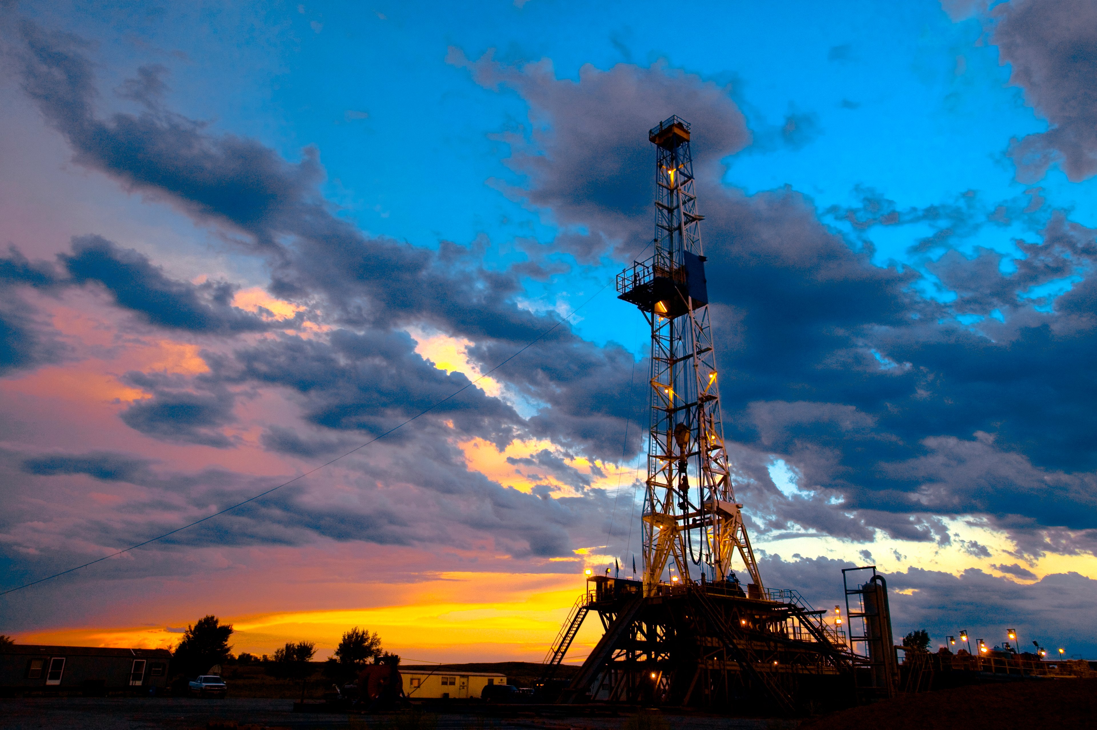 A drilling rig at sunset.