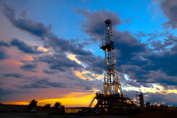 A drilling rig at sunset.