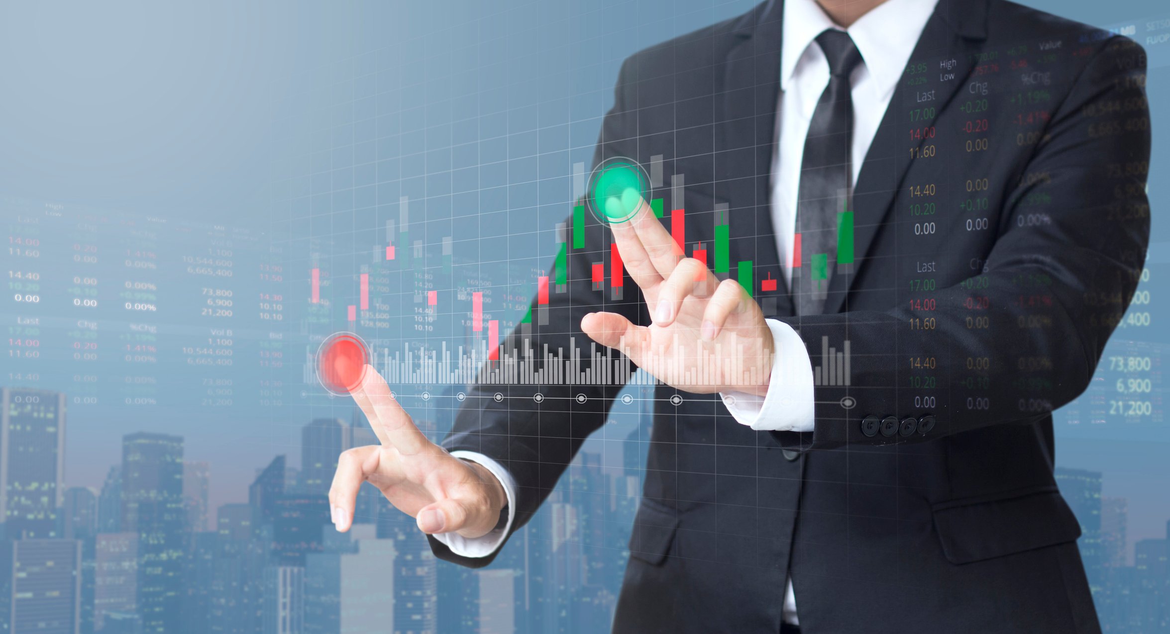 A man in a suit manipulating an on-screen chart with green positive bars and red negative bars