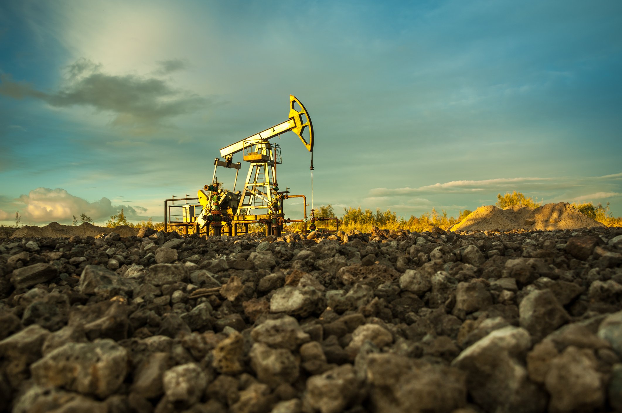 Oil pump with a rocky foreground.
