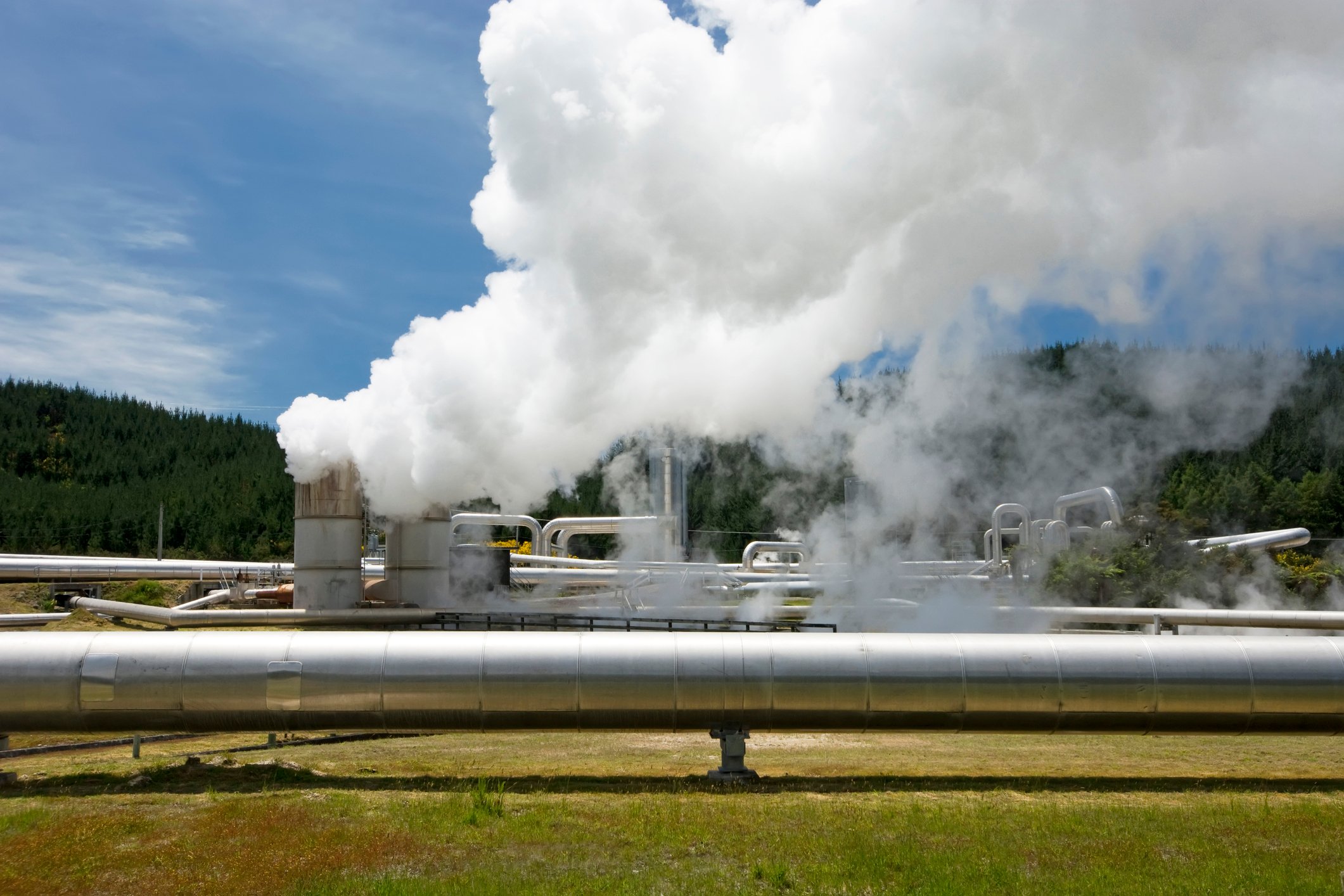An operating geothermal power plant in daylight