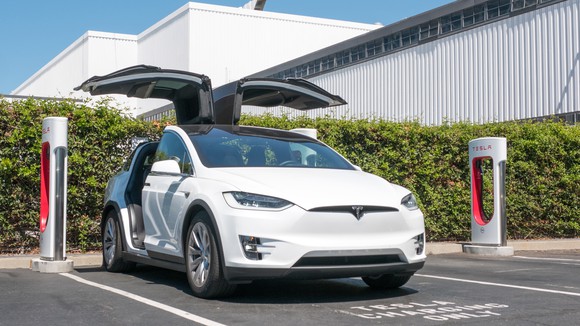 Tesla Model X charing at a Tesla Supercharger location outside of the company's vehicle factory