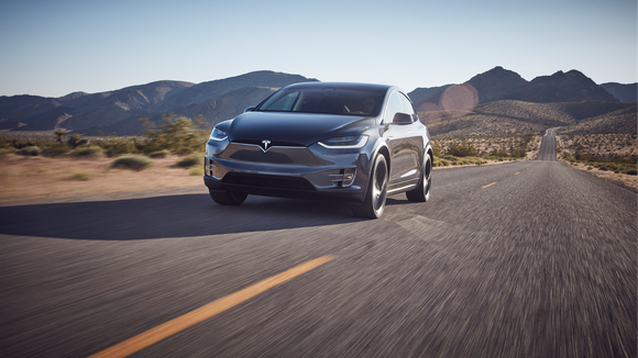 Model X driving on a mountain road