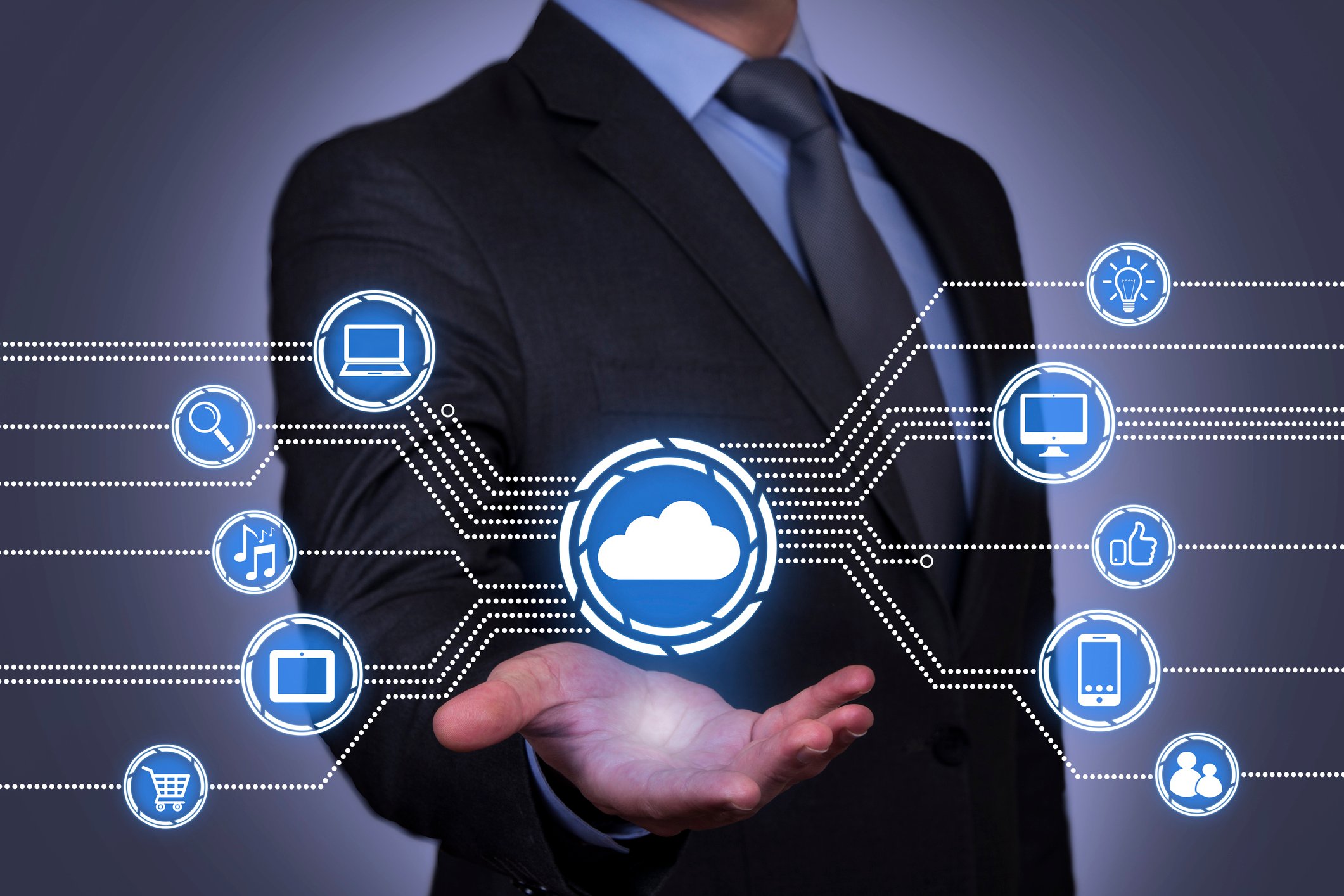 Businessman holding out his hand under a cloud image that's connected to other icons depicting various technologies and consumer services.