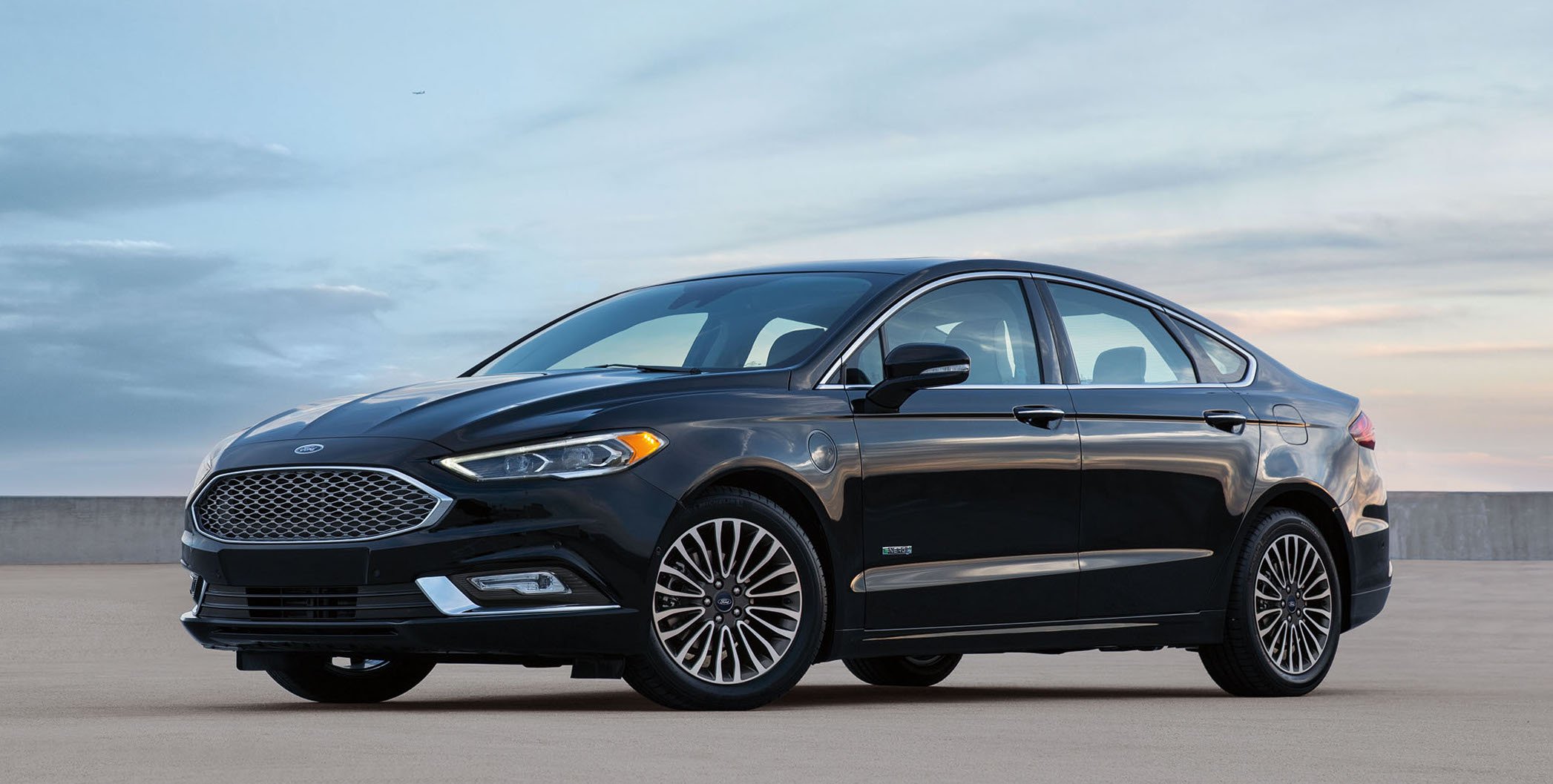 A black 2017 Ford Fusion Energi sedan.