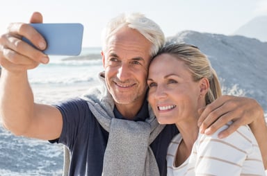 senior couple taking selfie_GettyImages-530589382
