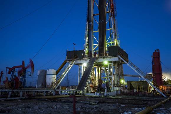 An oil drilling rigs with pump jacks.