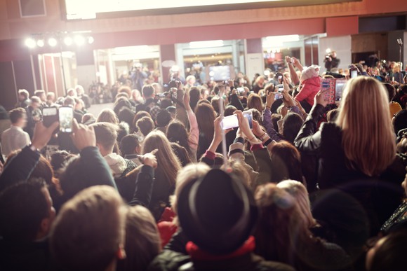 Crowd shooting photos at a red carpet movie premiere