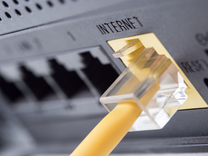 A cable wire inserted into a connection that says "Internet."