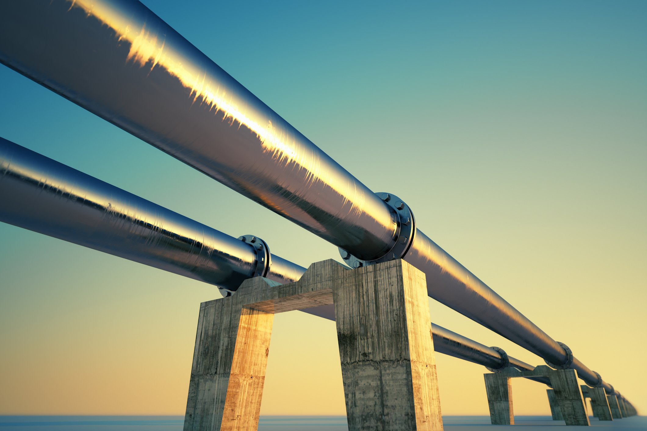 Twin pipelines at sunset.