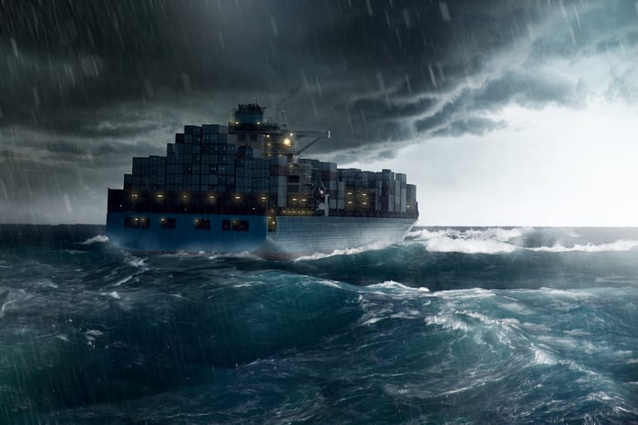 A container ship heading into a storm.