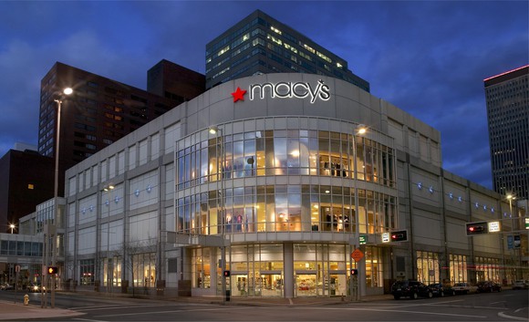The exterior of a Macy's store in downtown Cincinnati, seen at night.