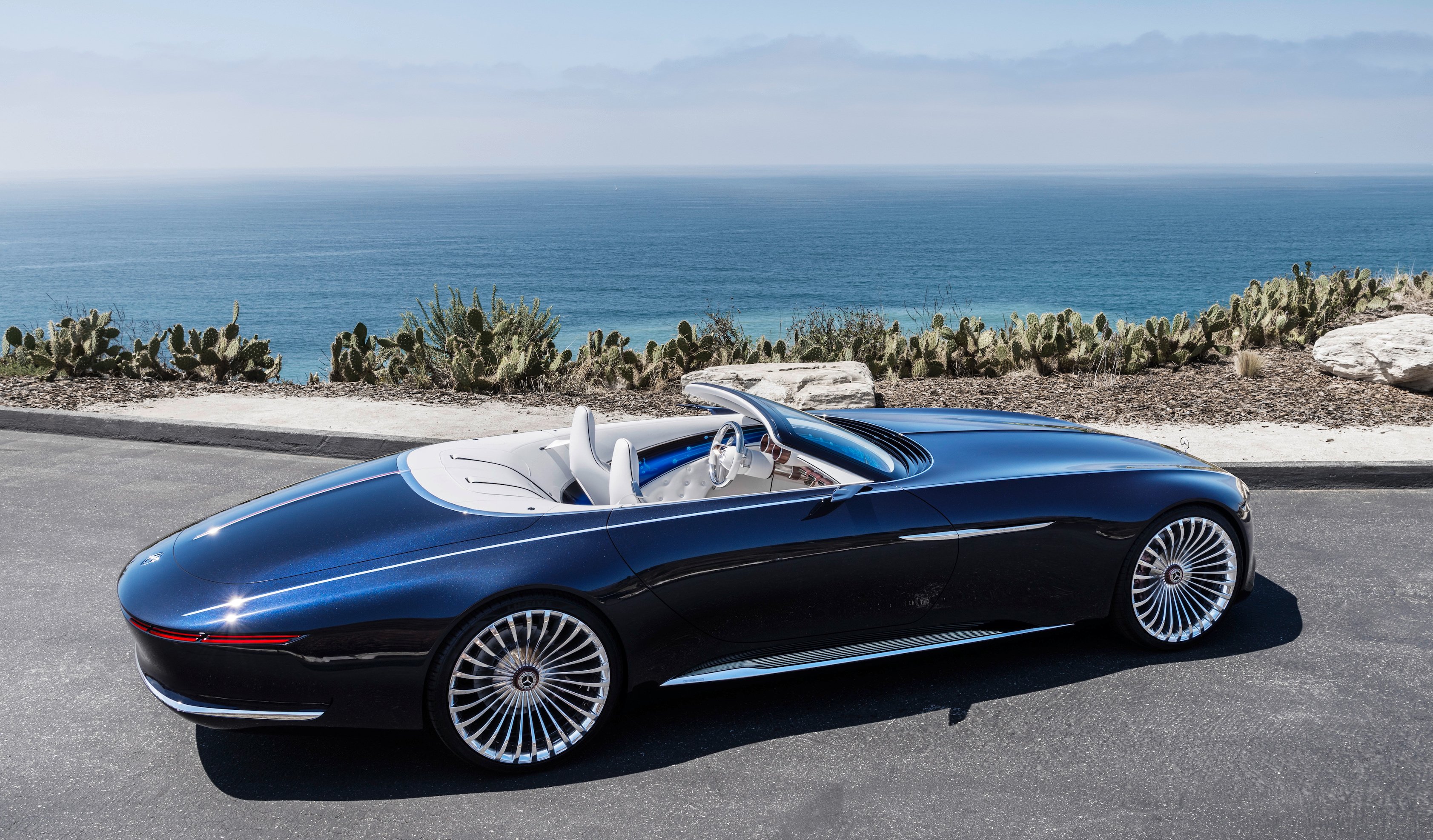 The Vision Mercedes-Maybach 6 Cabriolet, photographed near the ocean at an angle that shows its considerable length. 