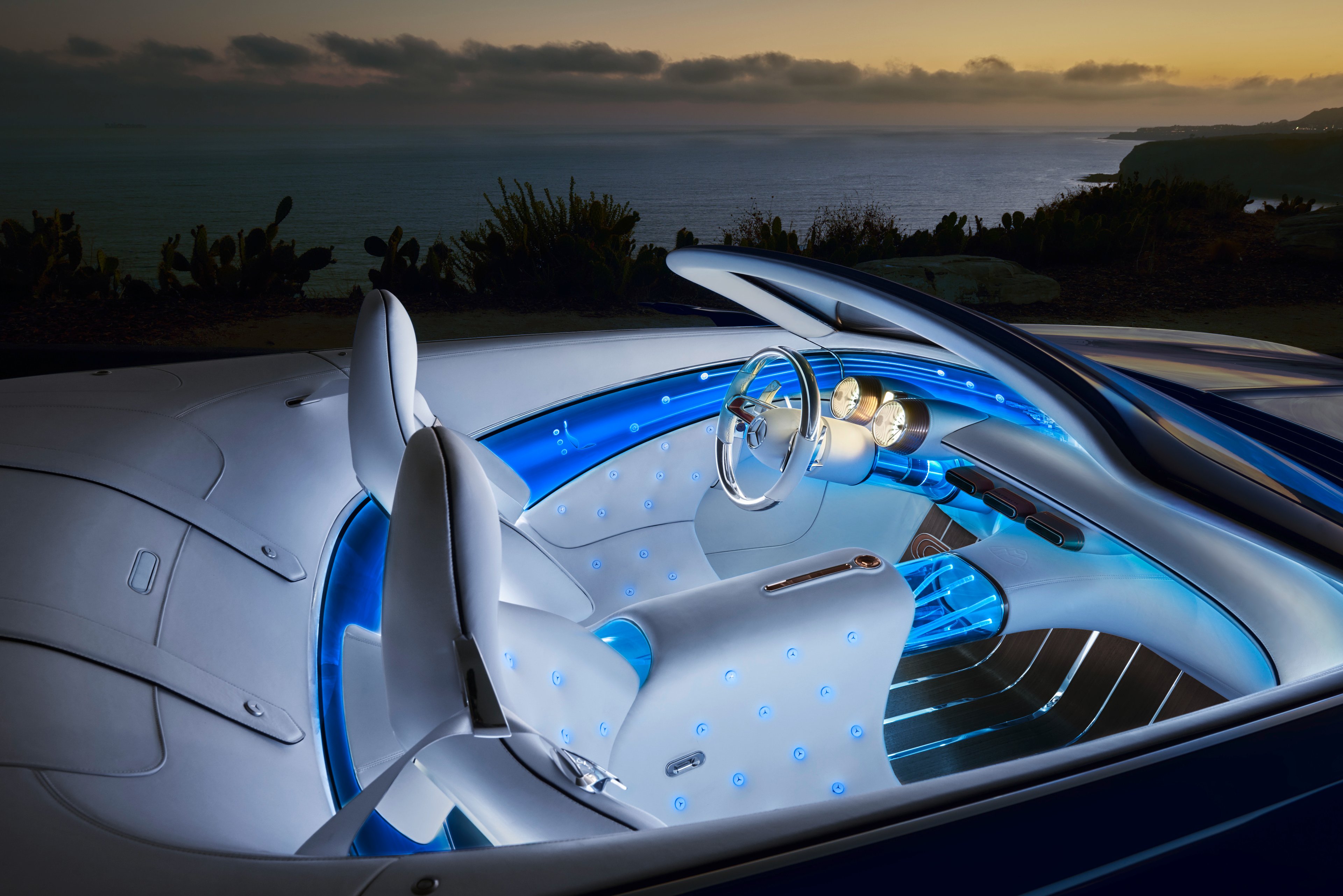 A close-up of the Vision Mercedes-Maybach 6 Cabriolet's two-seat interior, which features blue lighting and white leather.