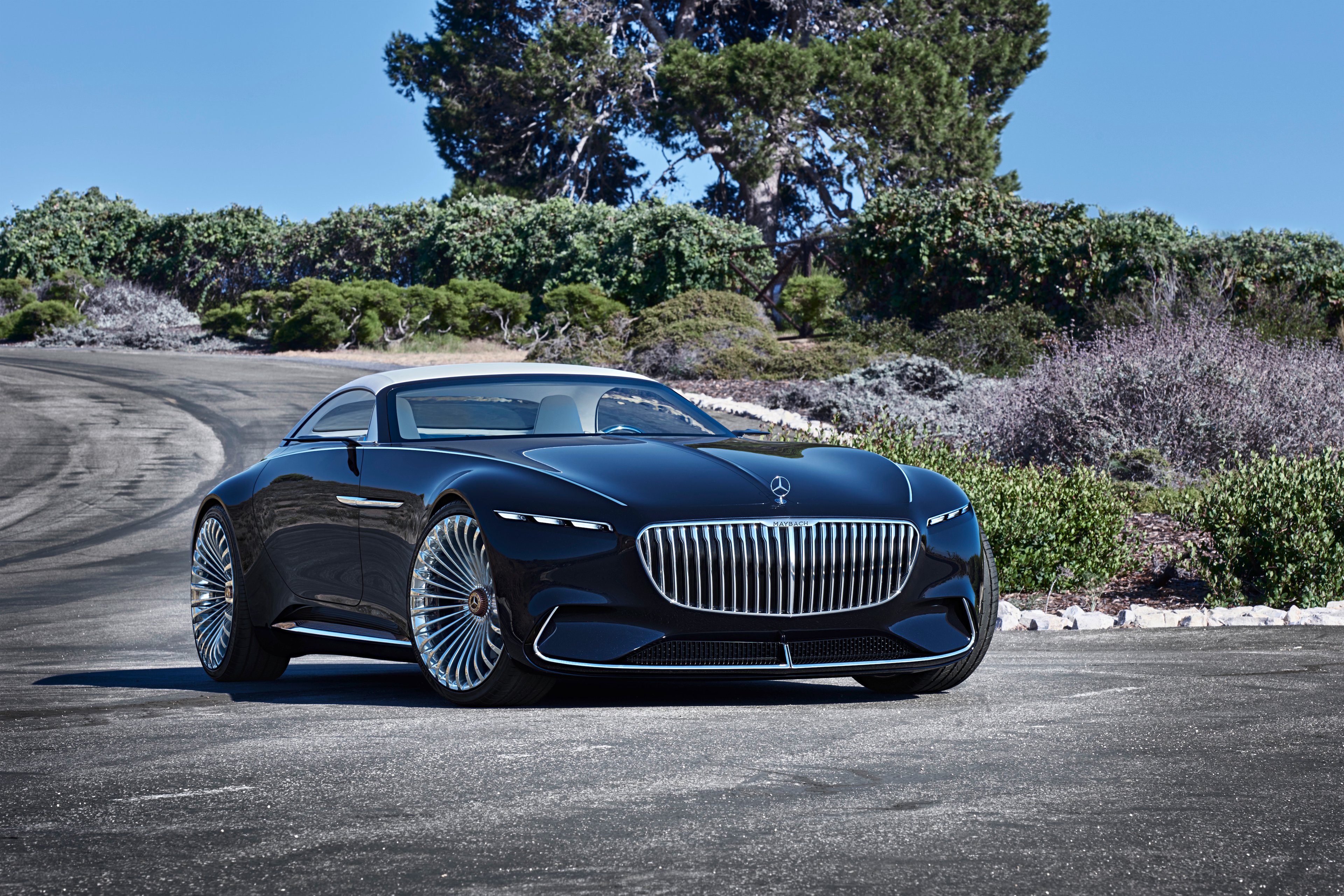 The Vision Mercedes-Maybach 6 Cabriolet, posed on a California coastal road in bright sunlight and viewed from a front quarter-angle. 