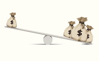 Money bags on seesaw