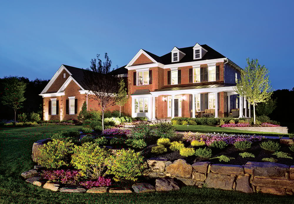 A large two-story home at dusk.