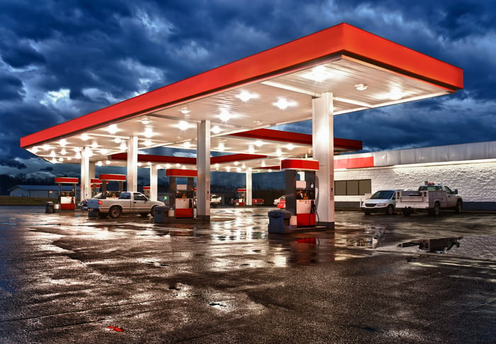 A gas station at night.