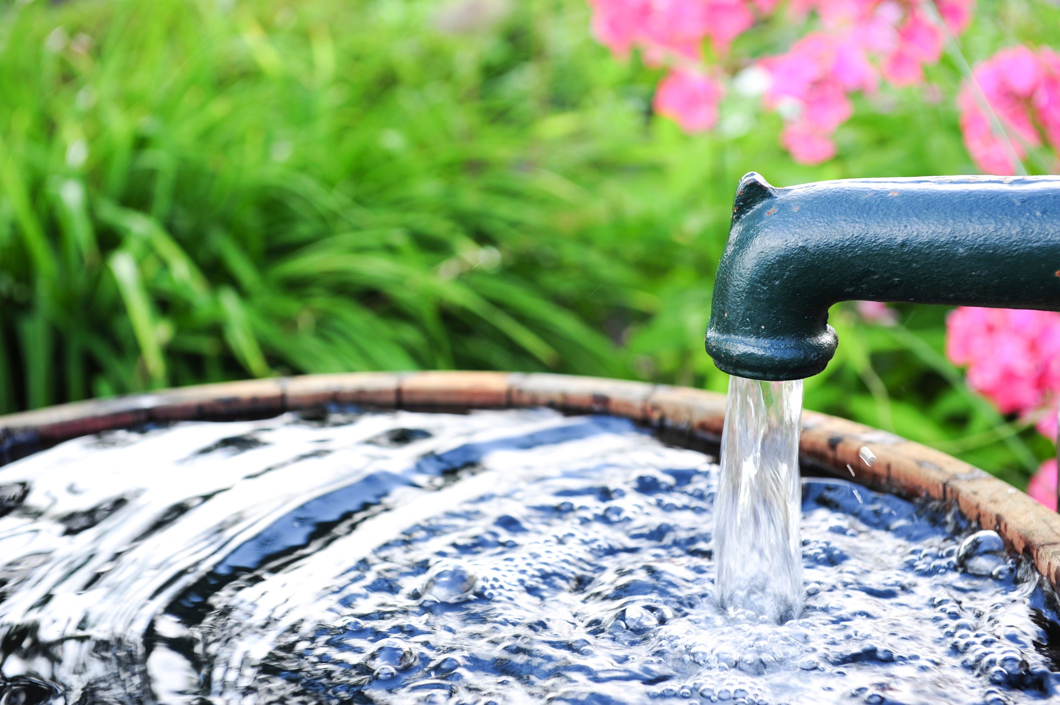 Watter From a Faucet Into a Bucket
