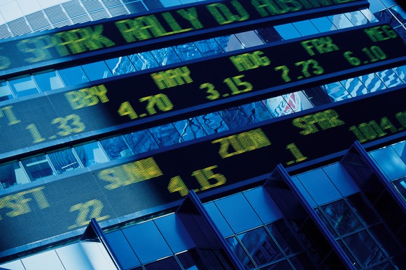 A stock sticker screen on a building.