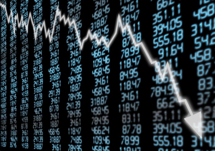 Falling stock chart superimposed over numbers