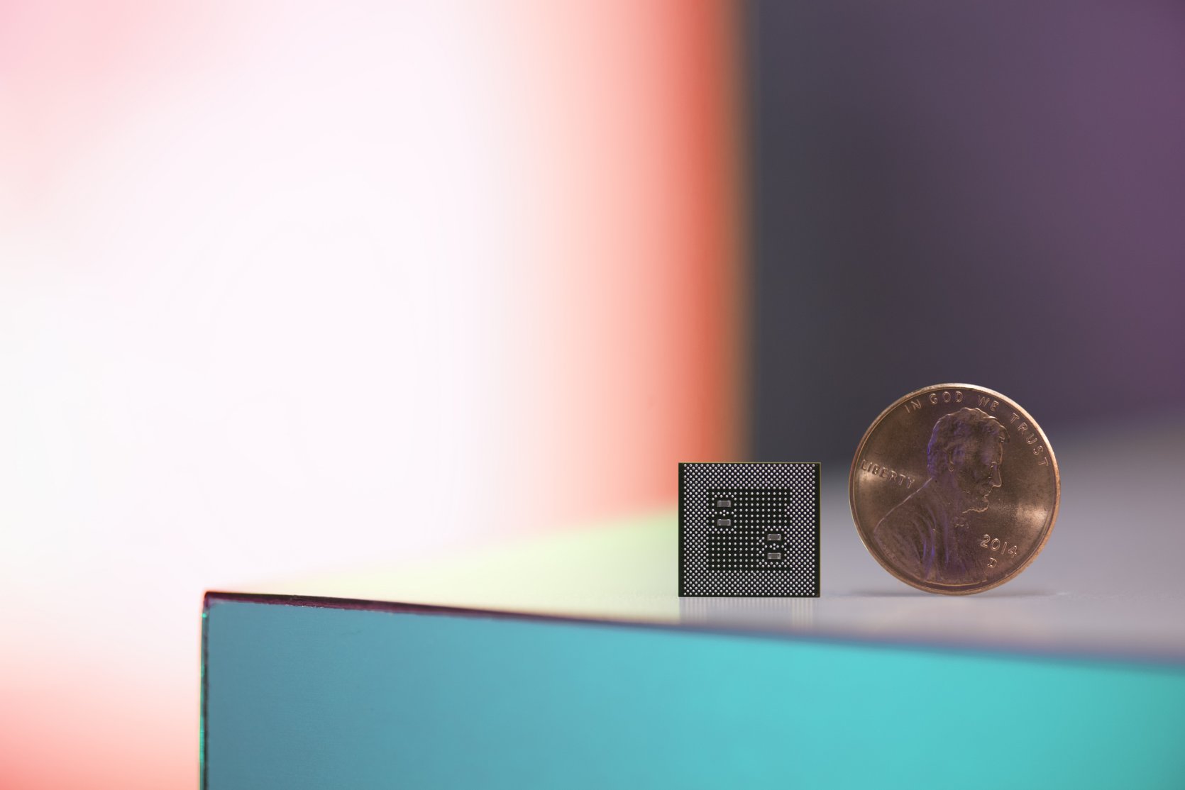 A Snapdragon 835 compared to a penny.