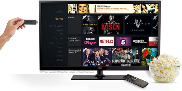 Amazon Fire TV Stick being inserted in TV