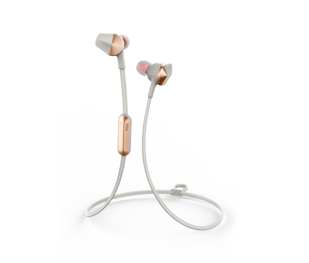 The new Fitbit Flyer headphones, displayed in white and gold.