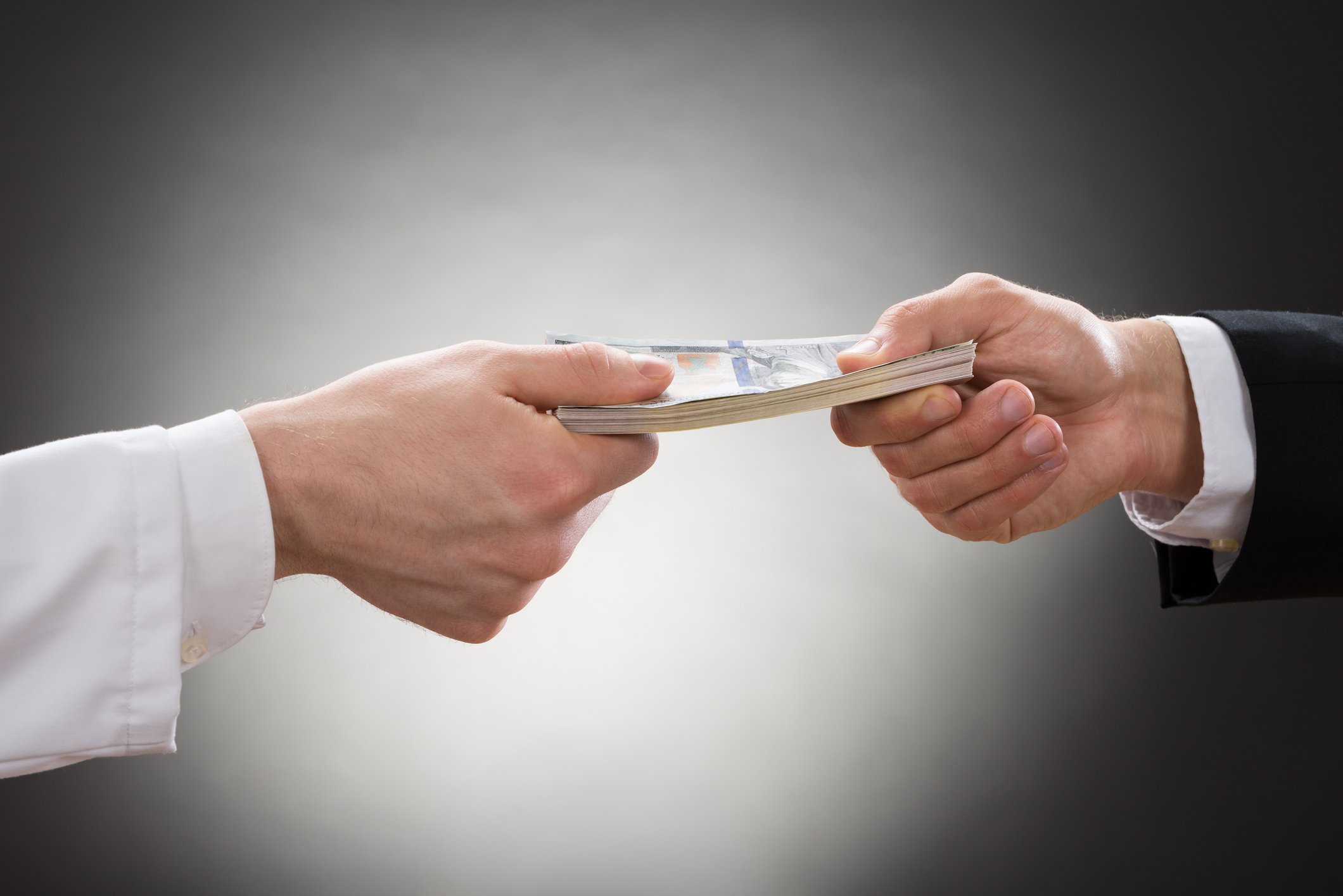 Handing money to doctor
