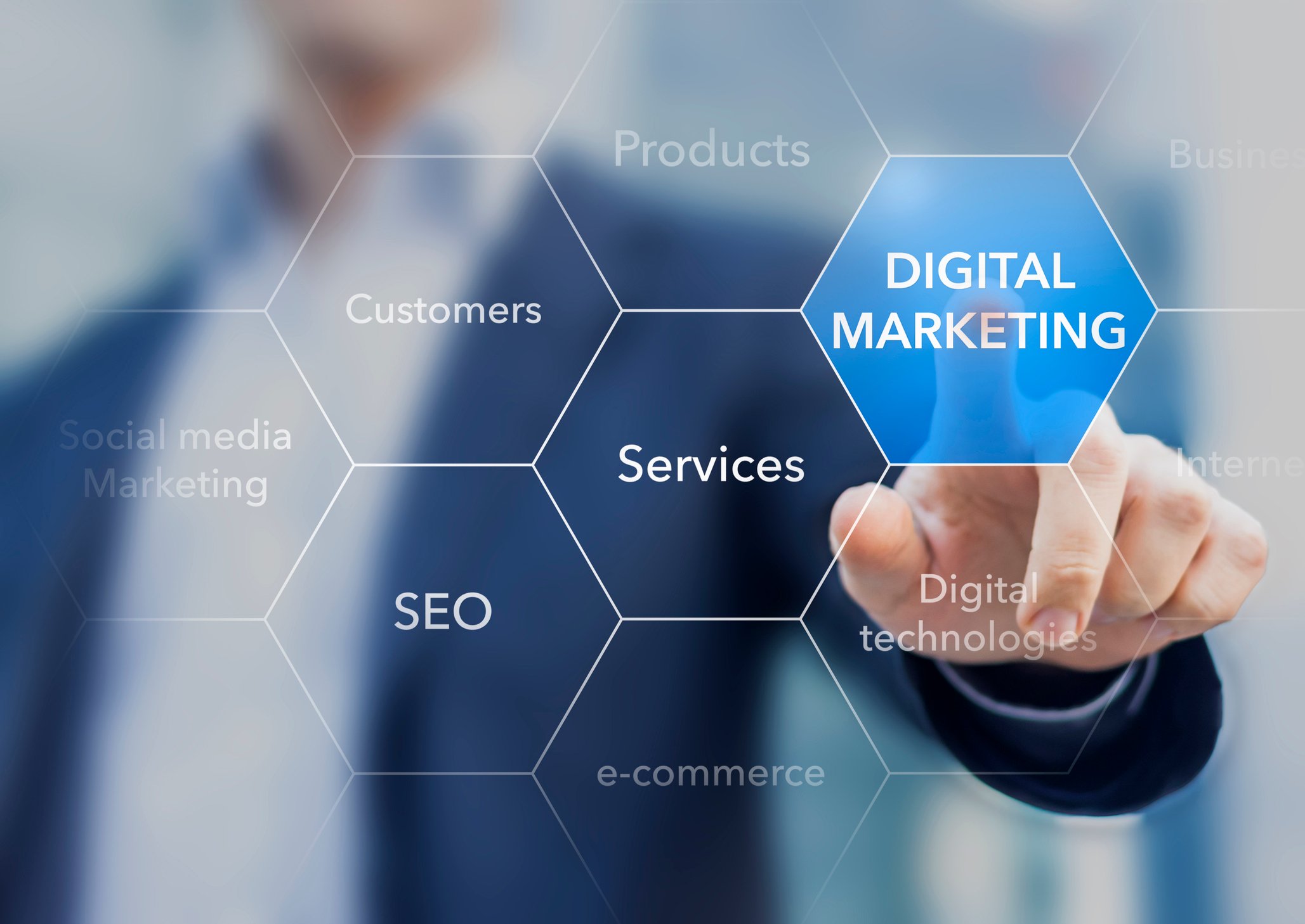 A businessperson pushing a button on a screen labeled "digital marketing."