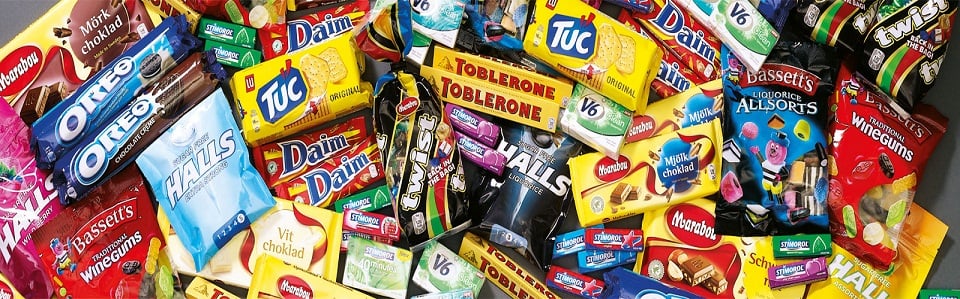 A pile of assorted snacks and candies sold by Mondelez