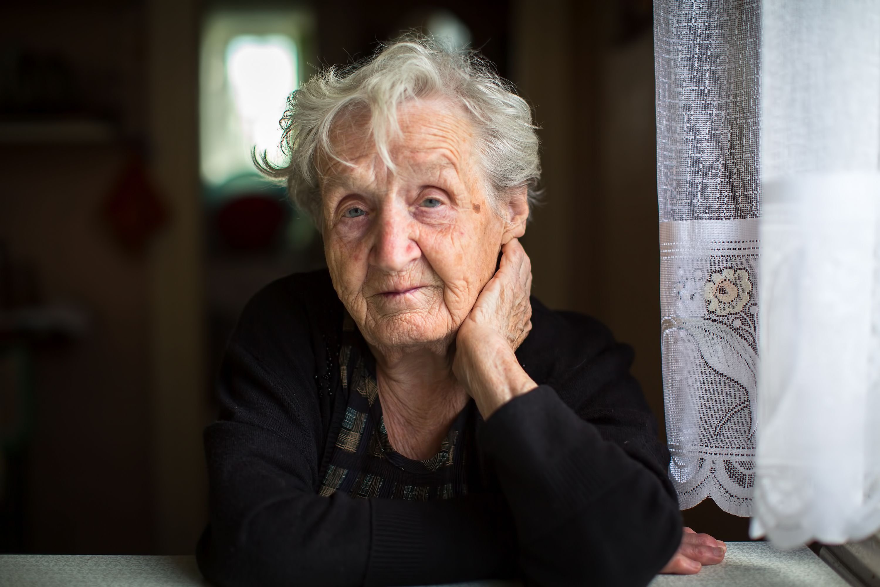 Elderly woman looking worried