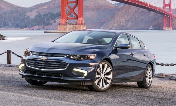 A 2017 Chevrolet Malibu sedan, parked near the Golden Gate Bridge in San Francisco.