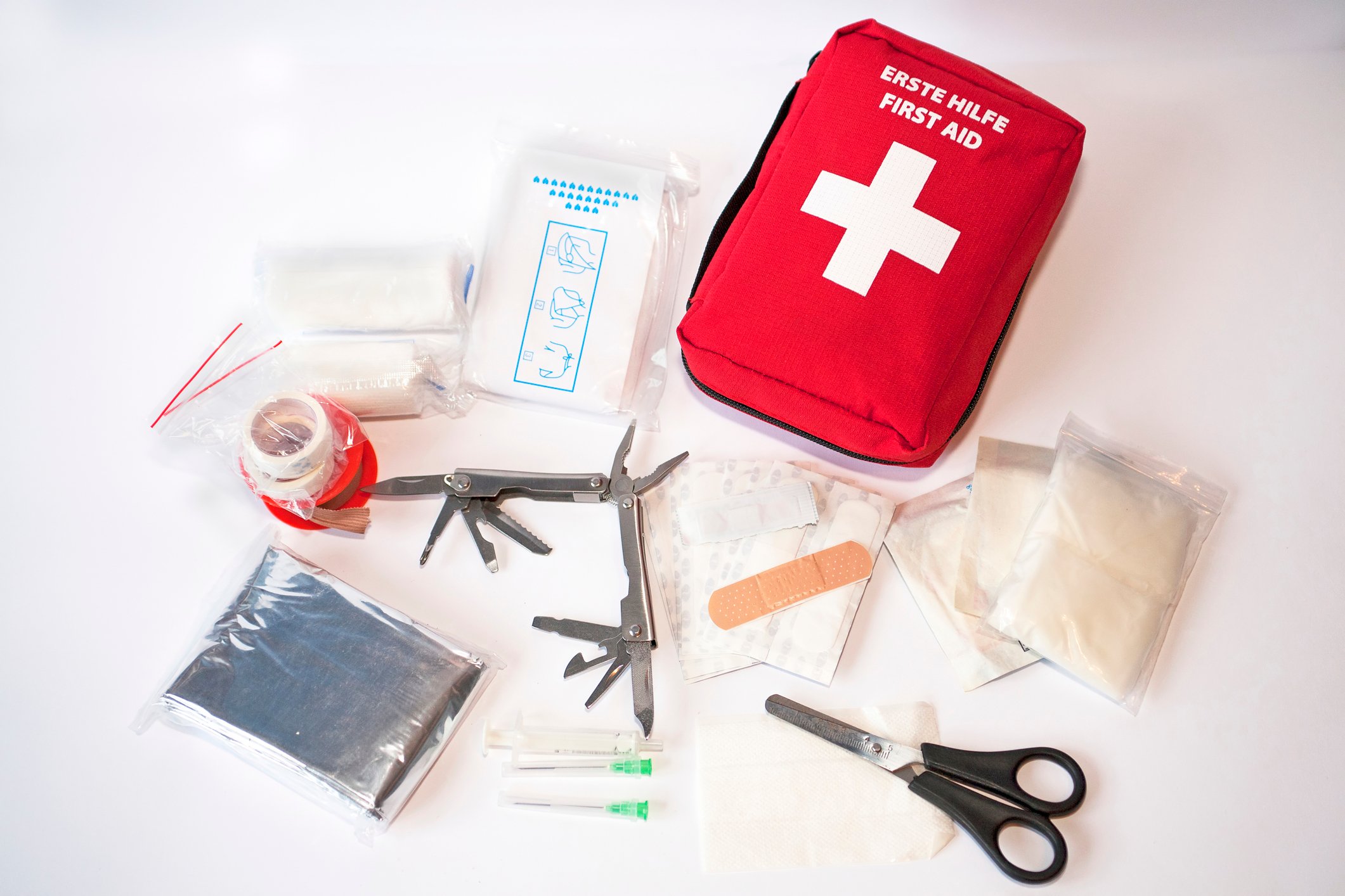 A first-aid kit is laid out.