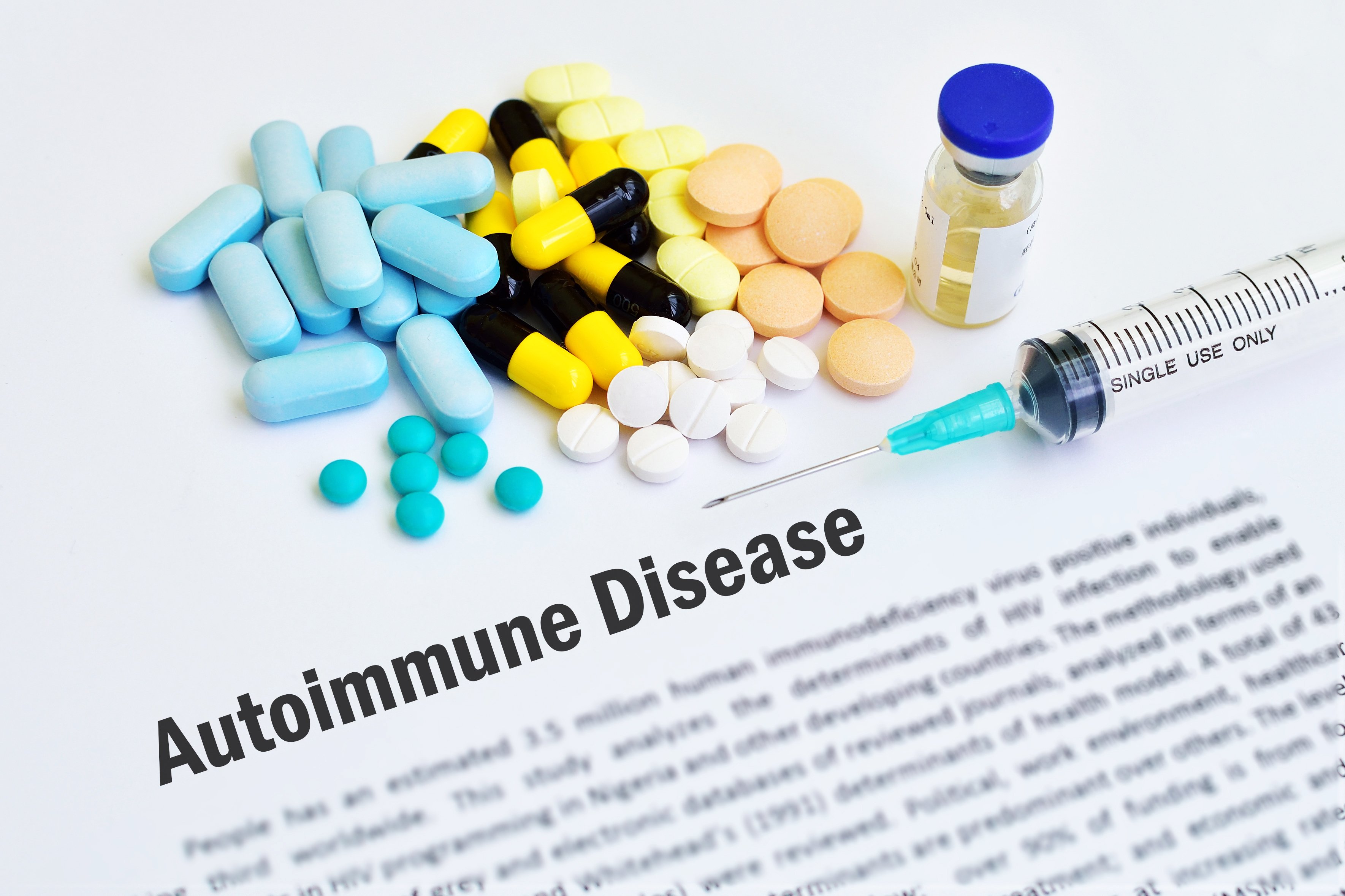 Autoimmune disease document with syringe and pills