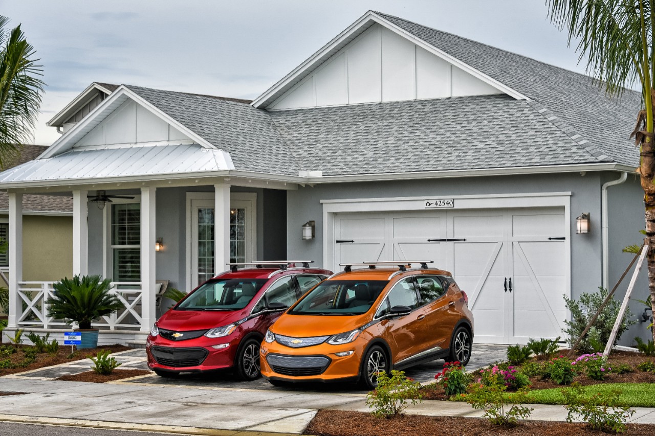 Two Bolt vehicles sitting in a driveway