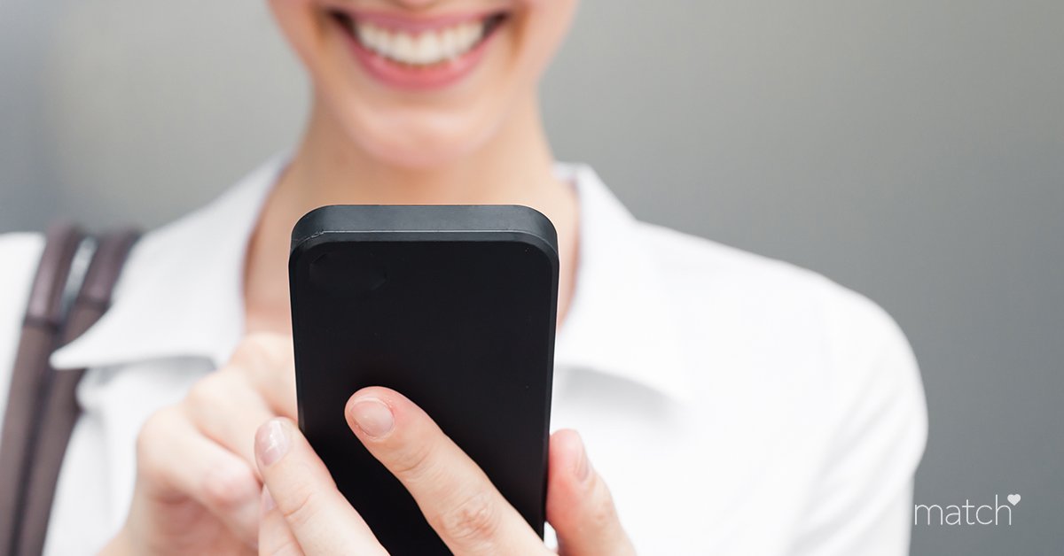 A Match.com spot with a smiling woman on the Match smartphone app.