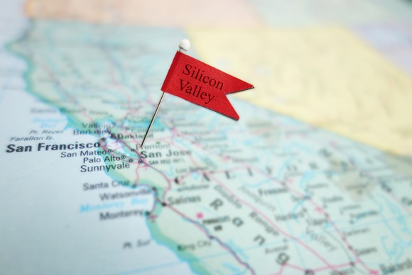 A Silicon Valley flag pinned to a paper map.