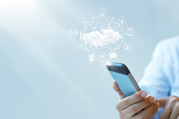 A man's smartphone links to a wide range of cloud-based apps.