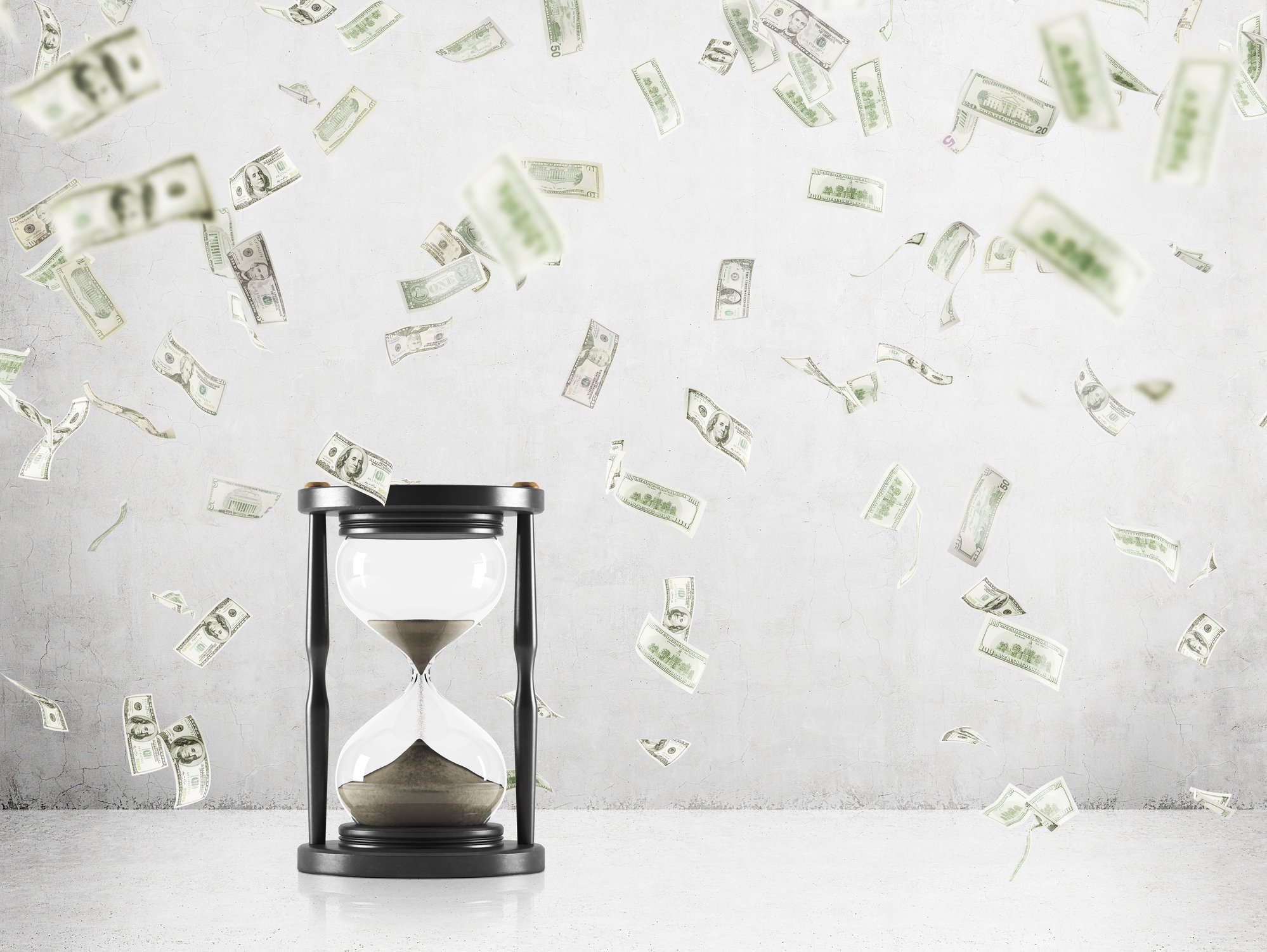 An hourglass with money raining around it.