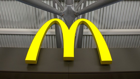 Close up of golden arches signage in a food court McDonald's.