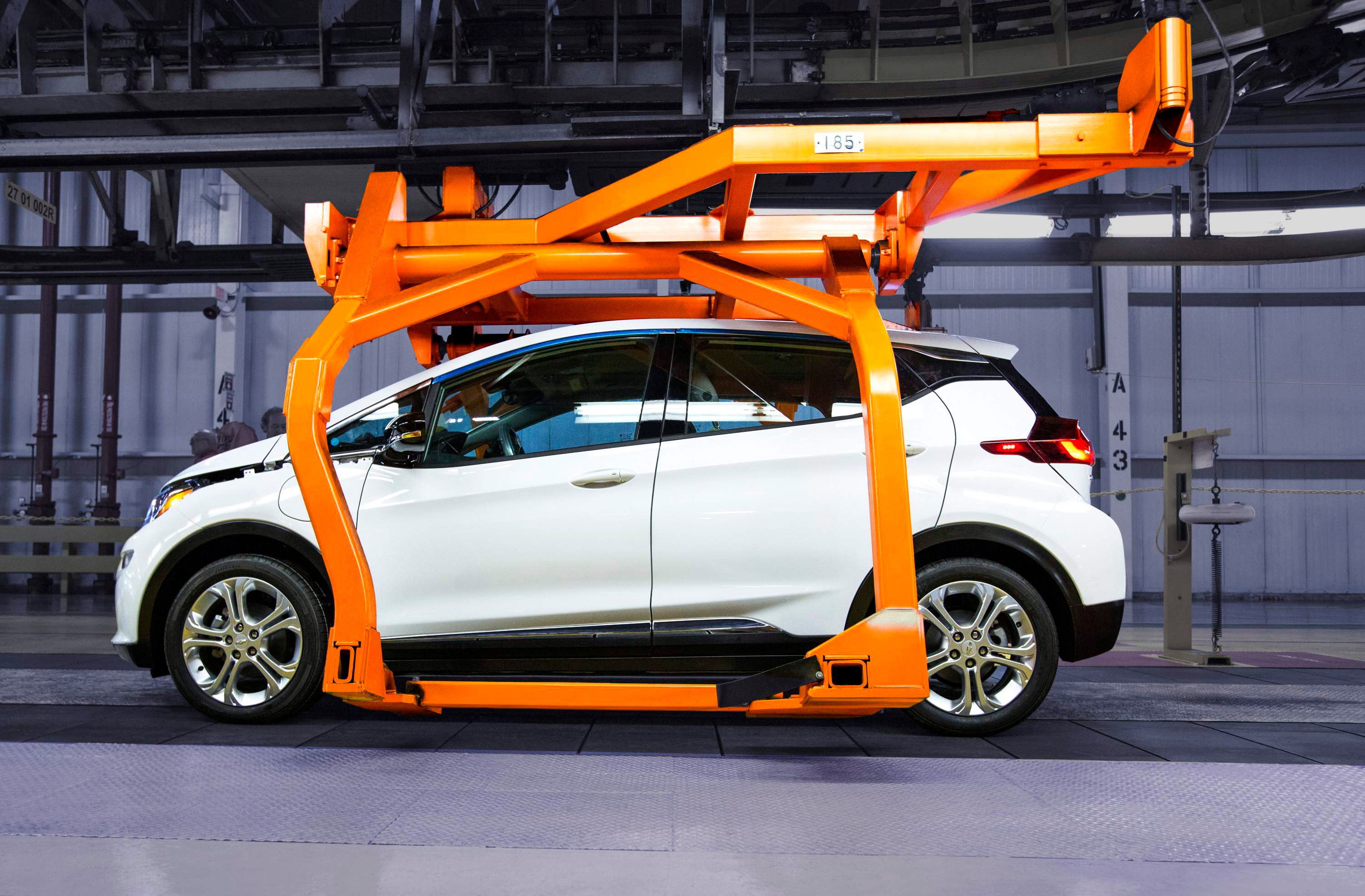 A white preproduction Chevrolet Bolt EV is shown on the assembly line at GM's factory in Orion Township, Michigan last year.