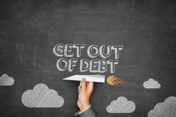 "Get out of debt" on a chalkboard